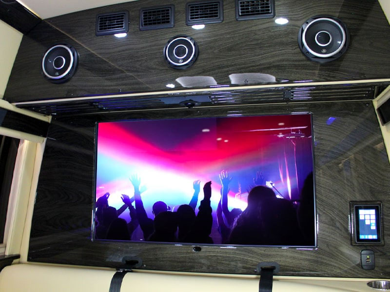 43" 4K TV in rear wall of limo