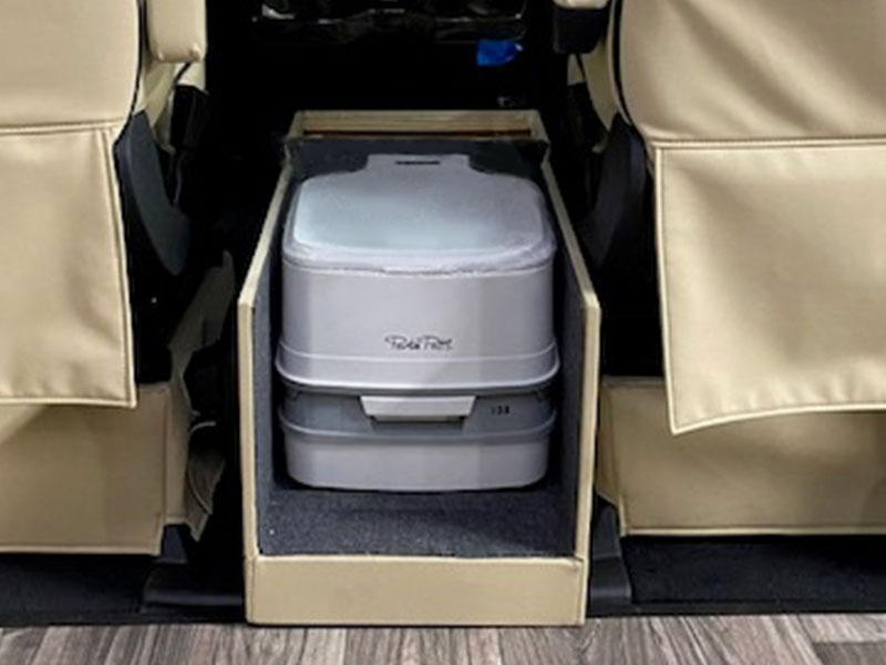 center console houses a portable travel toilet